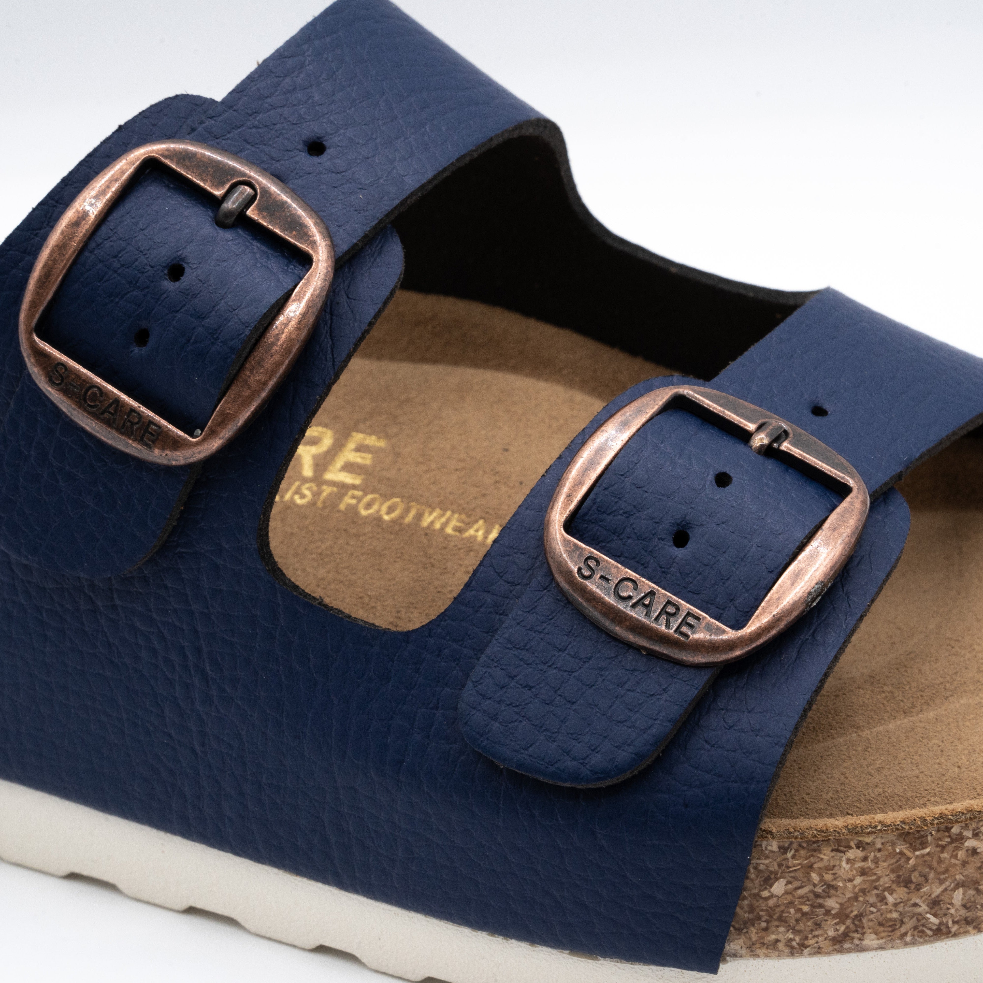 Close-up of S-CARE Doha Sandals in navy, showing texture details, stitching, and side buckle.