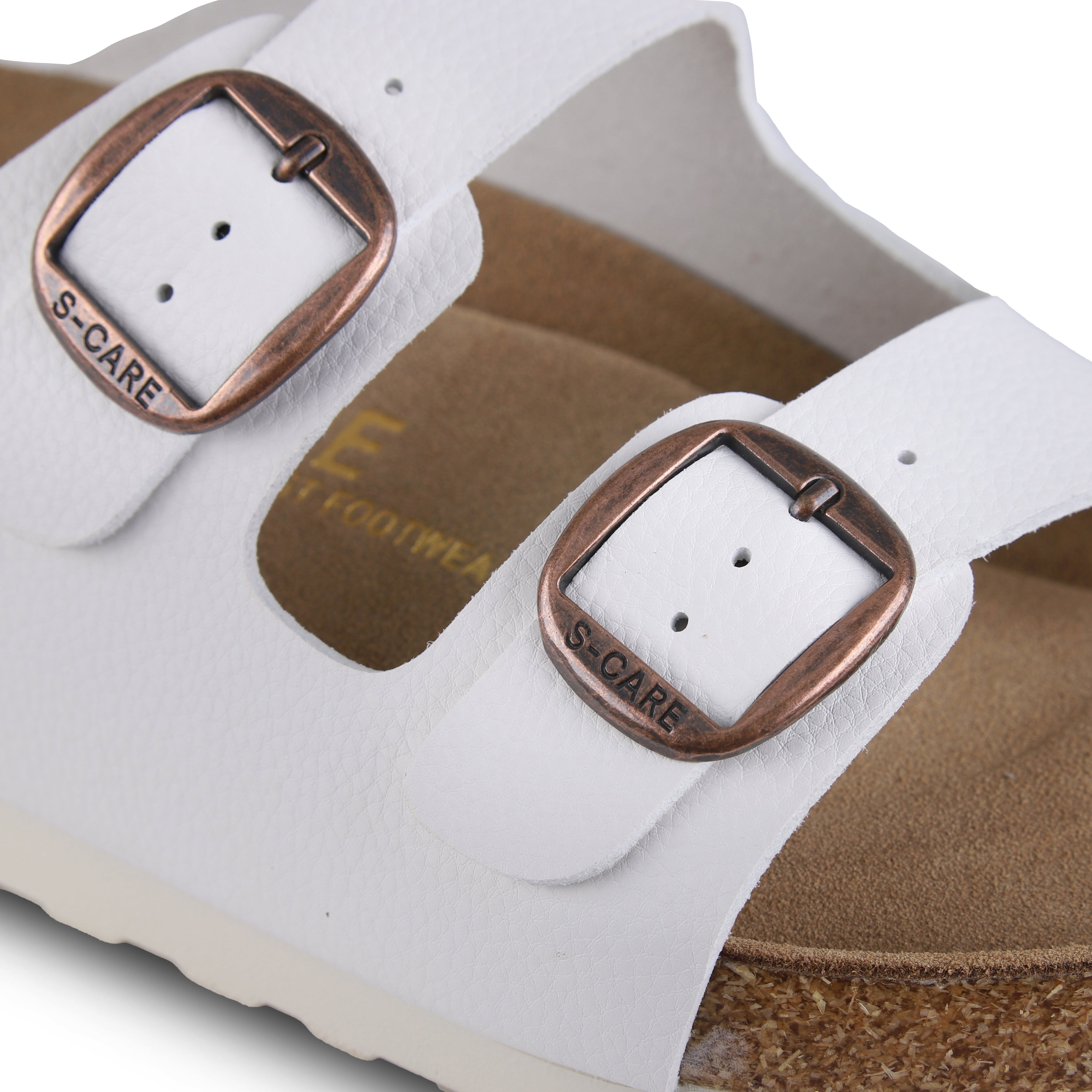 Close-up of S-CARE Doha Sandals in white, focusing on stitching, strap texture, and side buckle detail.