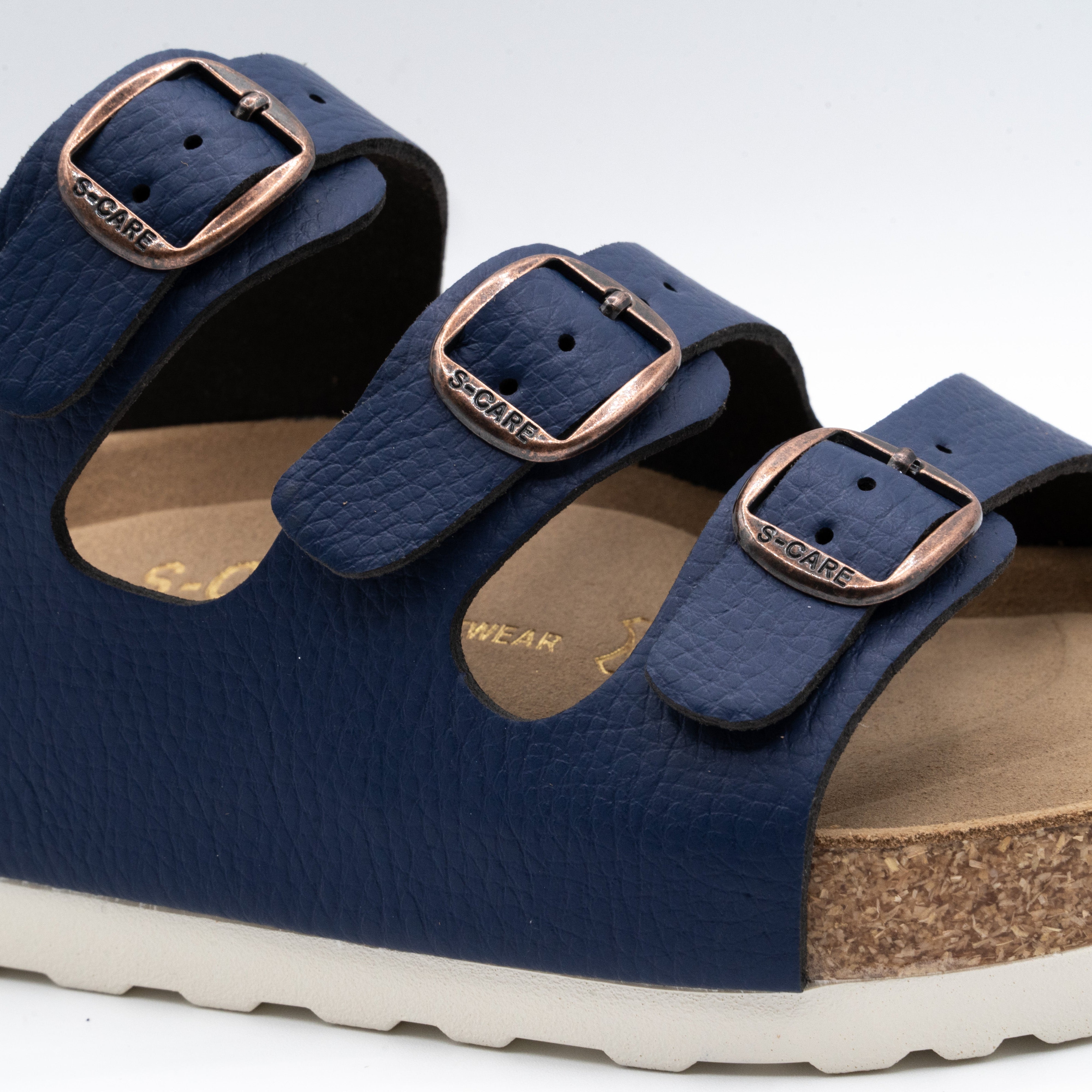Close-up of S-CARE Muscat Sandals in navy, highlighting stitching, material grain, and cushioning.
