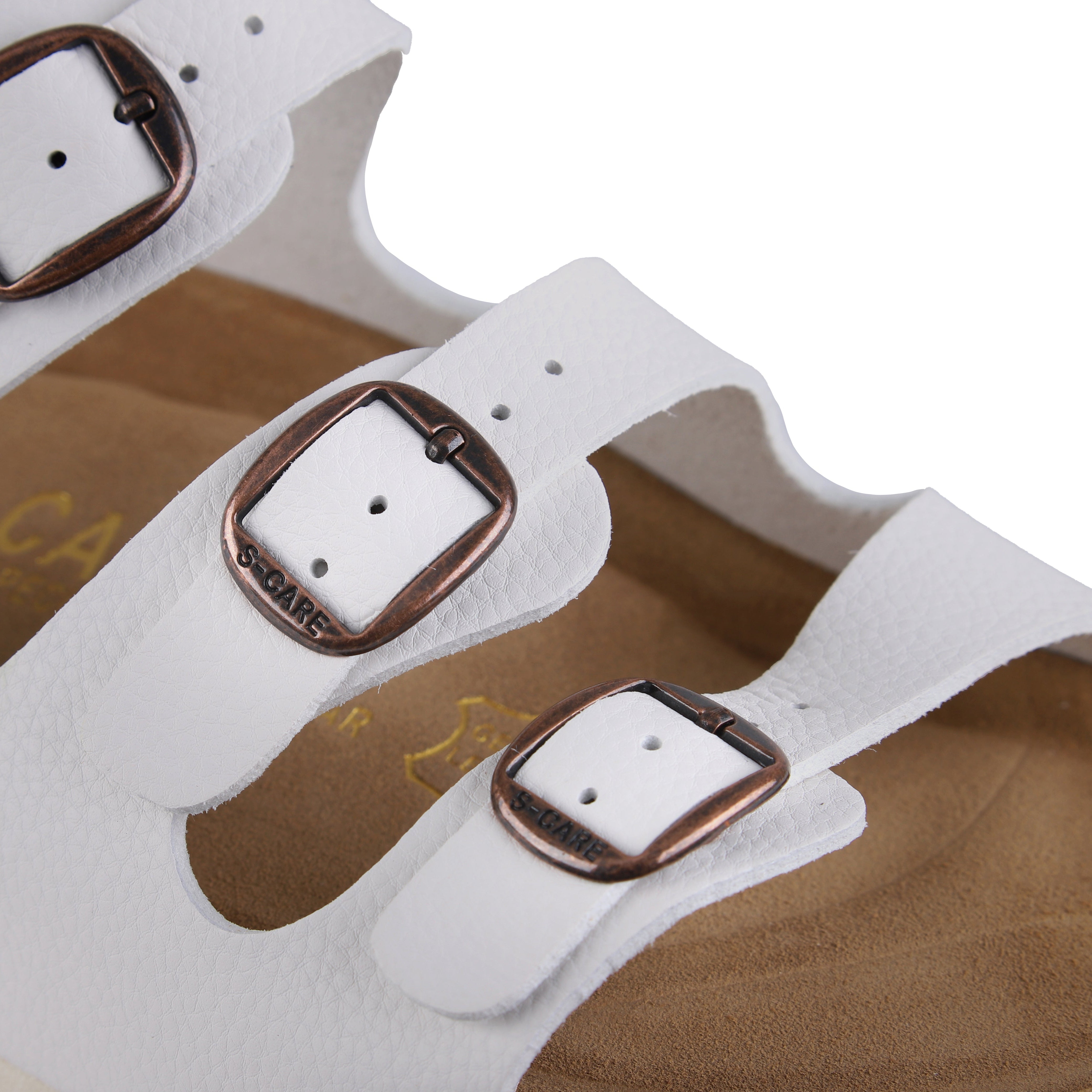 Close-up of S-CARE Muscat Sandals in white, capturing the texture, stitching, and buckle details.